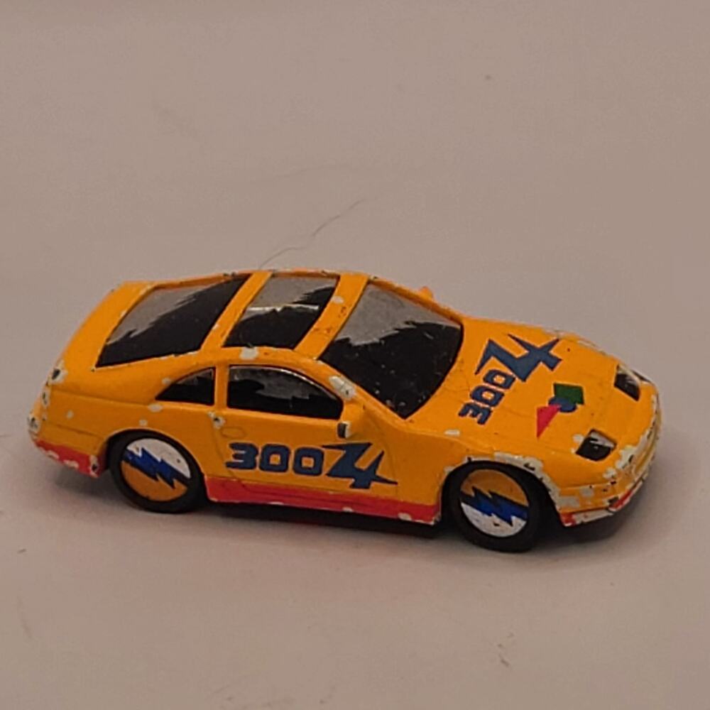 Matchbox Nissan 300ZX diecast car. Pink damage